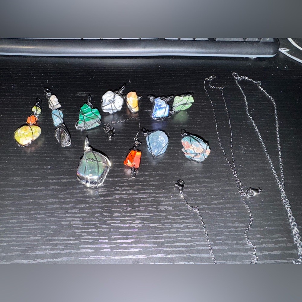 Custom made jewelry (stones) wrapped in black chain/wire
